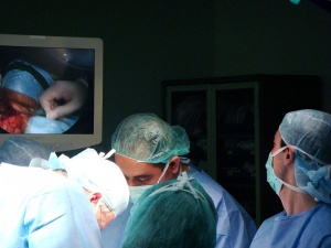 Doctors performing an abortion on a woman.