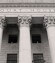 The front of a court house with columns.